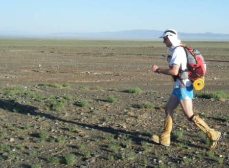 Chris running through the Gobi Desert Chris running through the Gobi Desert
